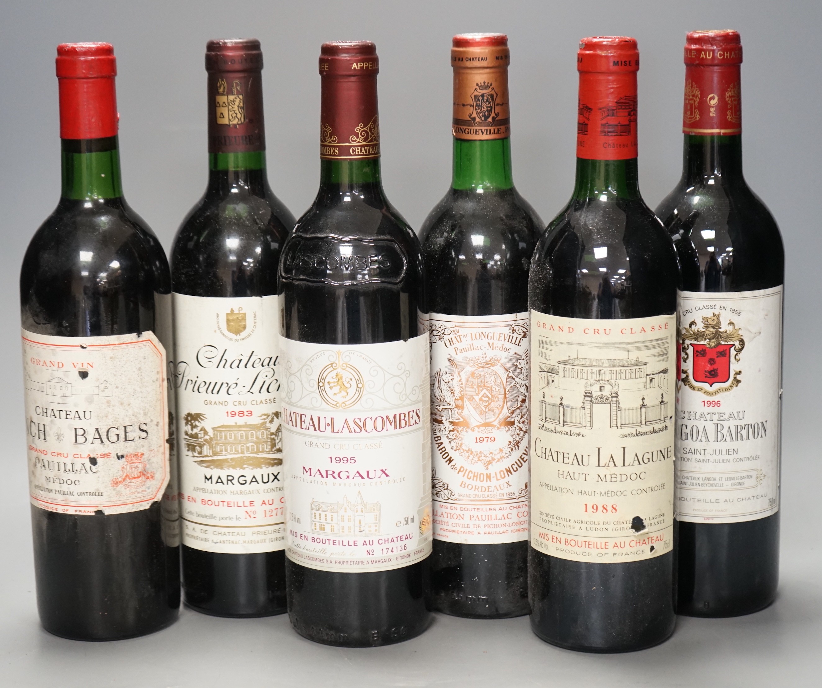 Six bottles of wine: Chateau Longville Pauillac Medoc 1979, Chateau Lascombes Margaux 1979, Chateau Lynch Bages Pauillac 1975, Chateau La Lagune Medoc 1988, Chateau Langoa Barton Saint-Julien 1996 and Chateau Prieure-Lic